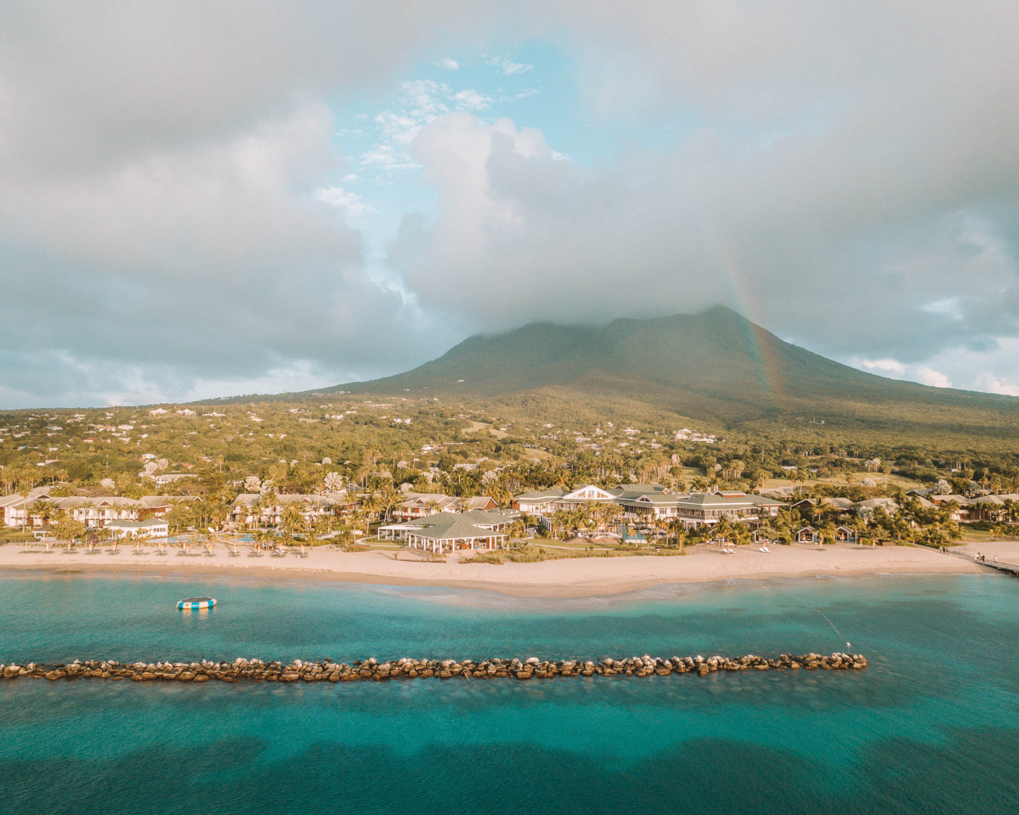 drone photo with a rainbow at four seasons resort nevis