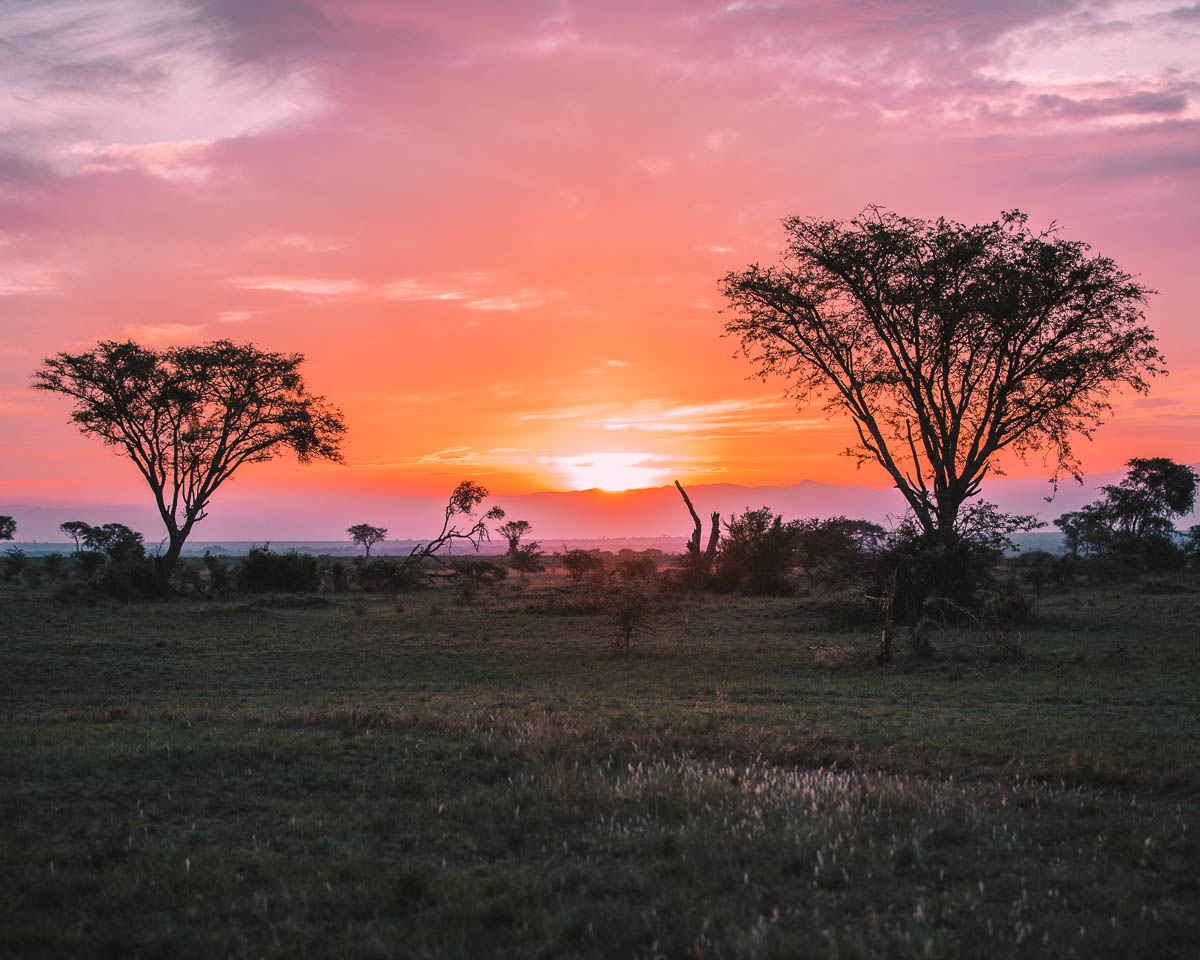 sunset in queen elizabeth national park uganda itinerary