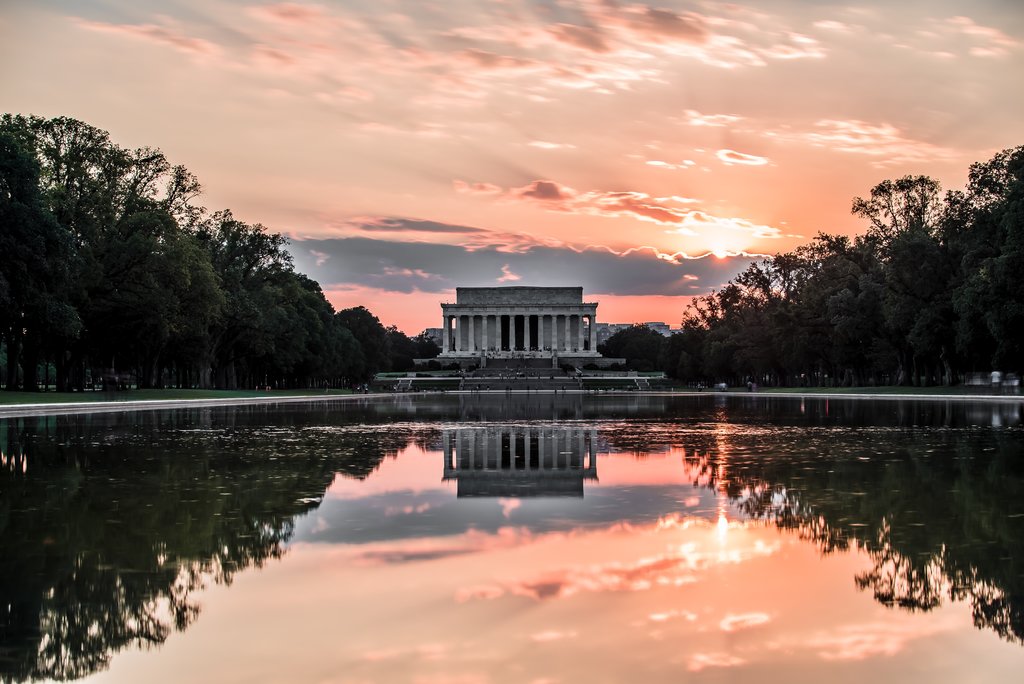sunset over monument in washington dc best road trips usa