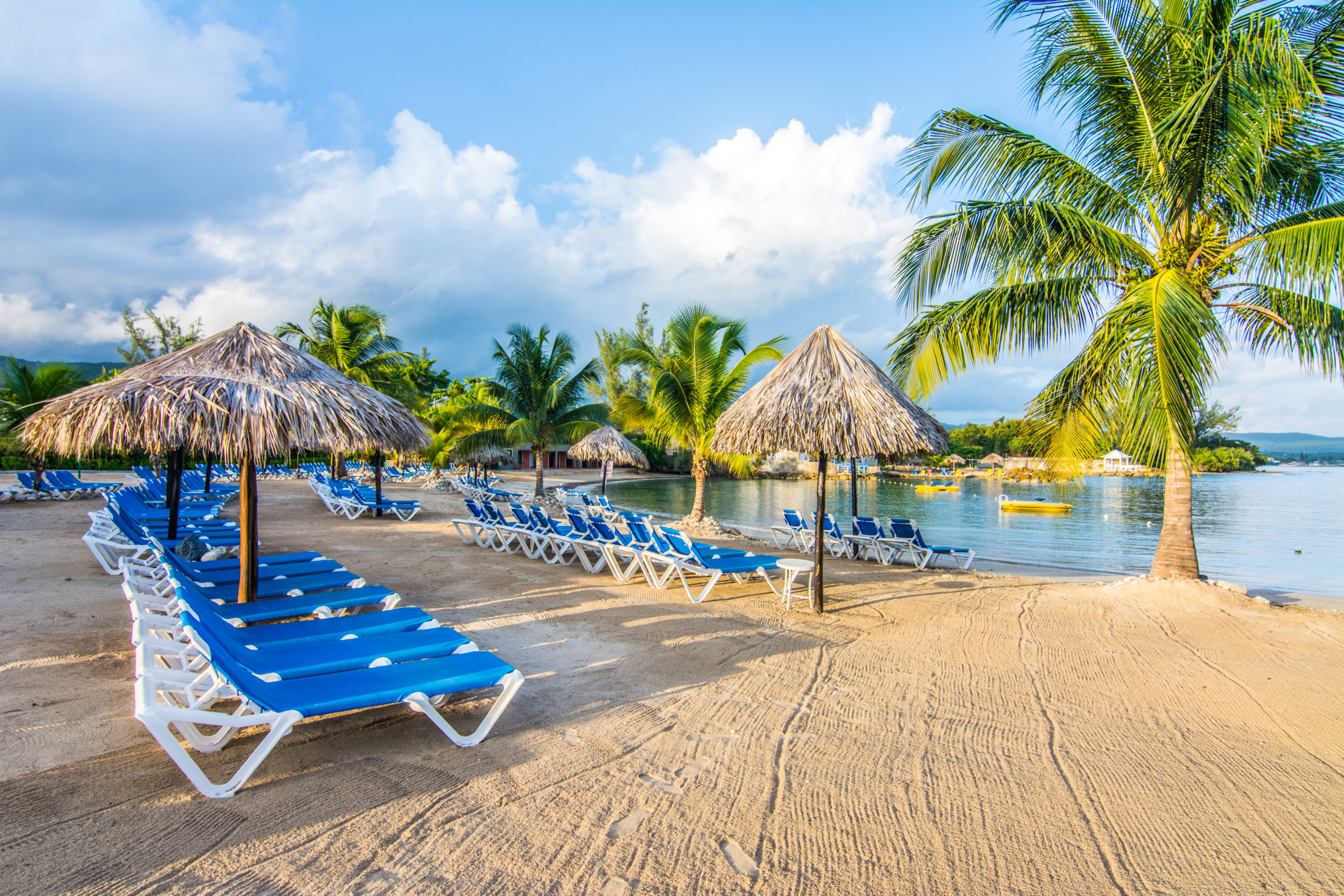 Beach with palm trees at Jewel Paradise Cove in Jamaica