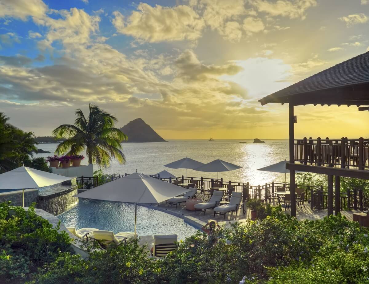 view of pool at cap maison st lucia at sunset