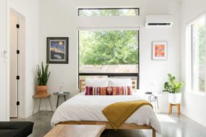 natural light bedroom with pops of color airbnb in austin