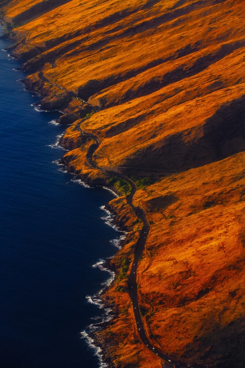 aerial view of orange coast where the road meets the sea