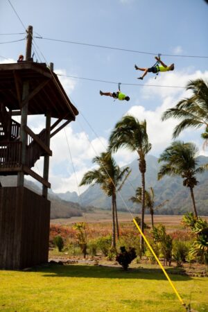 two people zip lining from platform, one of the best things to do in maui hawaii