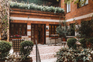 brick courtyard with vibrant tile and lots of greenery in bogota luxury hotel four seasons casa medina