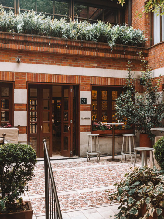 brick courtyard with vibrant tile and lots of greenery in bogota luxury hotel four seasons casa medina