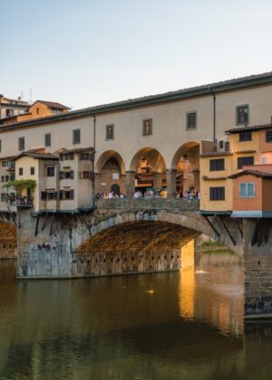 view of famous ponte vecchio bridge sitting over the arno river in florence italy