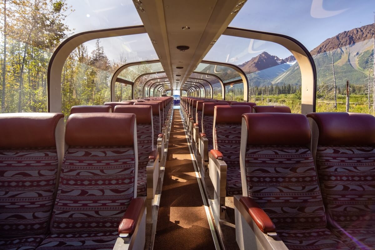 alaska railroad goldstar service seats with open dome windows showing the alaskan wilderness all around